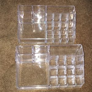 Two lucite makeup caddies